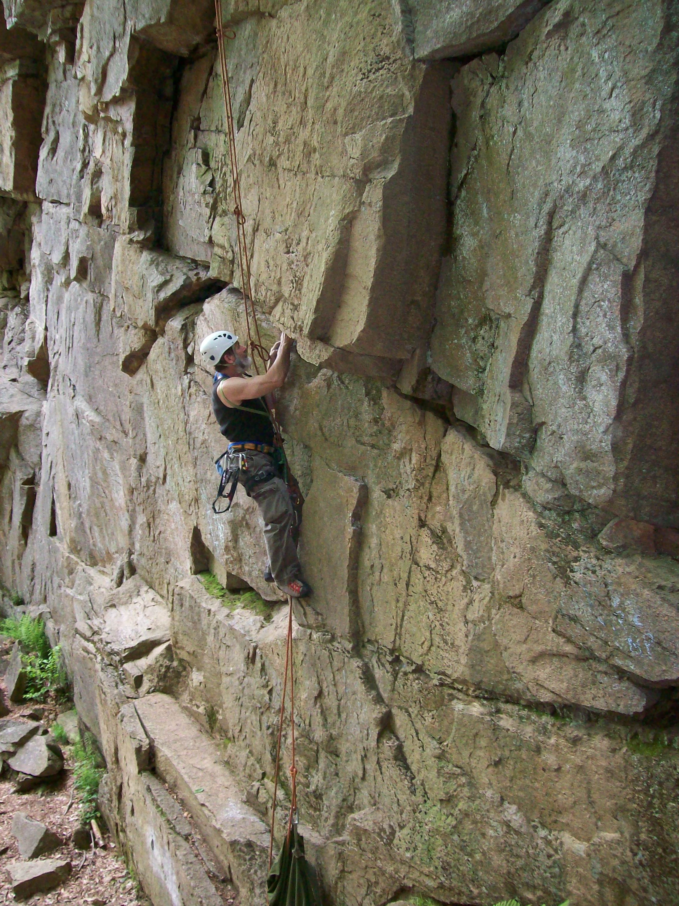 Ron smiling with his climbing gear